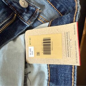 Levi's Blue Denim Jeans with Distressed Look and Contrast Stitching